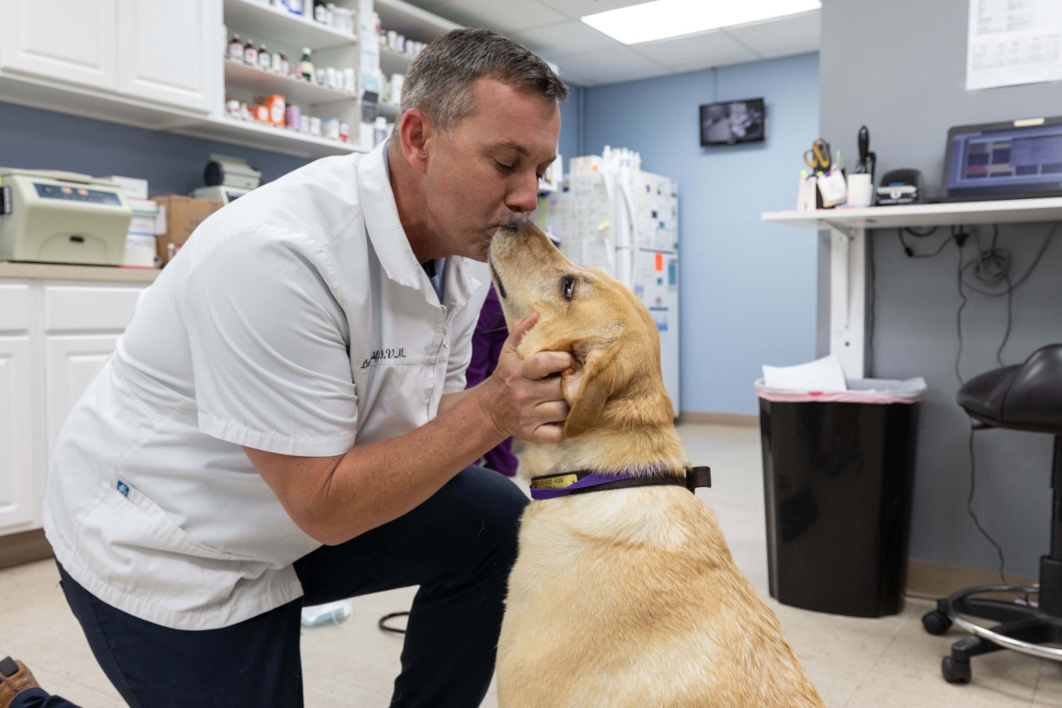 Dr. getting Kisses from dog